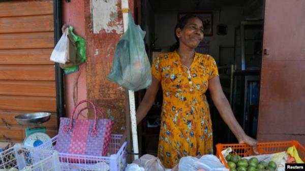 Nancy Hemalatha, 61, a fruit seller waits for customers at her shop in Thotalanga, Colombo, Sri Lanka, Sept. 9, 2024.