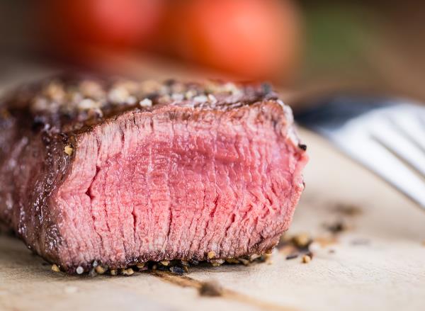 Close-up shot of grilled beef on a vintage background